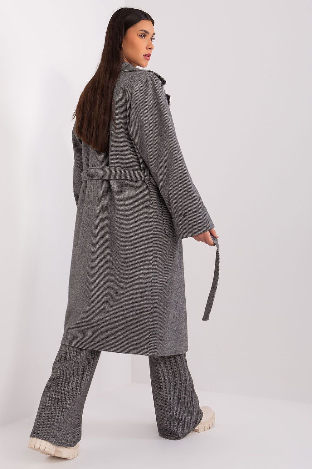 Classic transitional coat with over-the-knee length, decorative tie belt, and patch pockets.