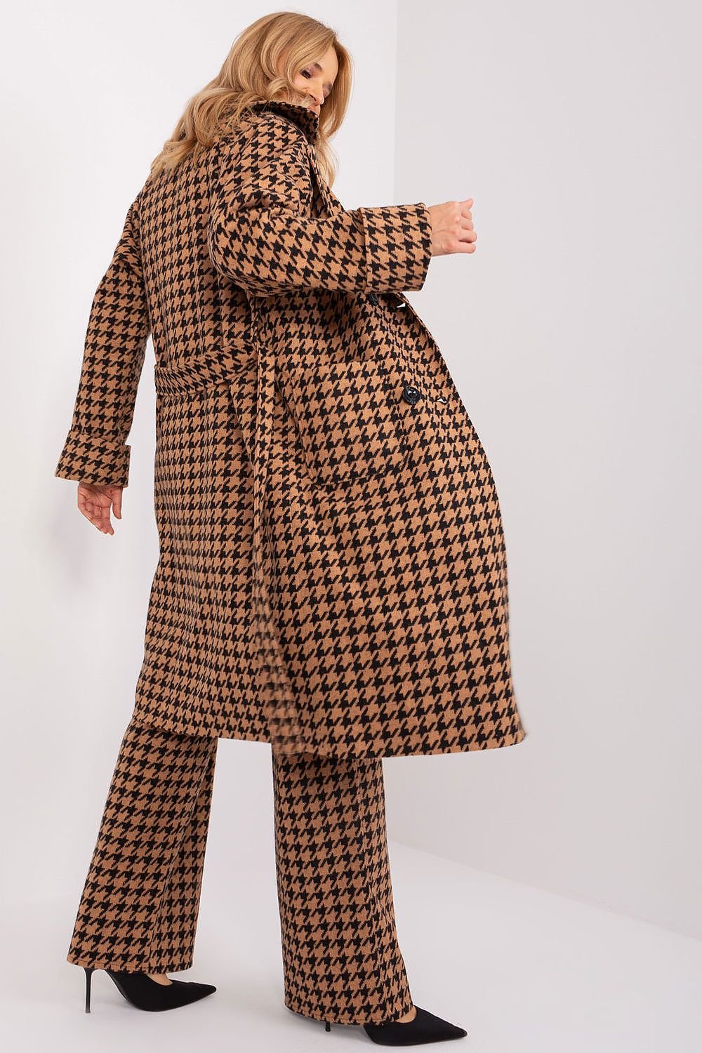 Classic transitional coat with houndstooth pattern and tie belt.