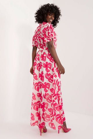 Summer floral dress with pink and red leaf pattern, maxi length, puff sleeves, and tie belt.