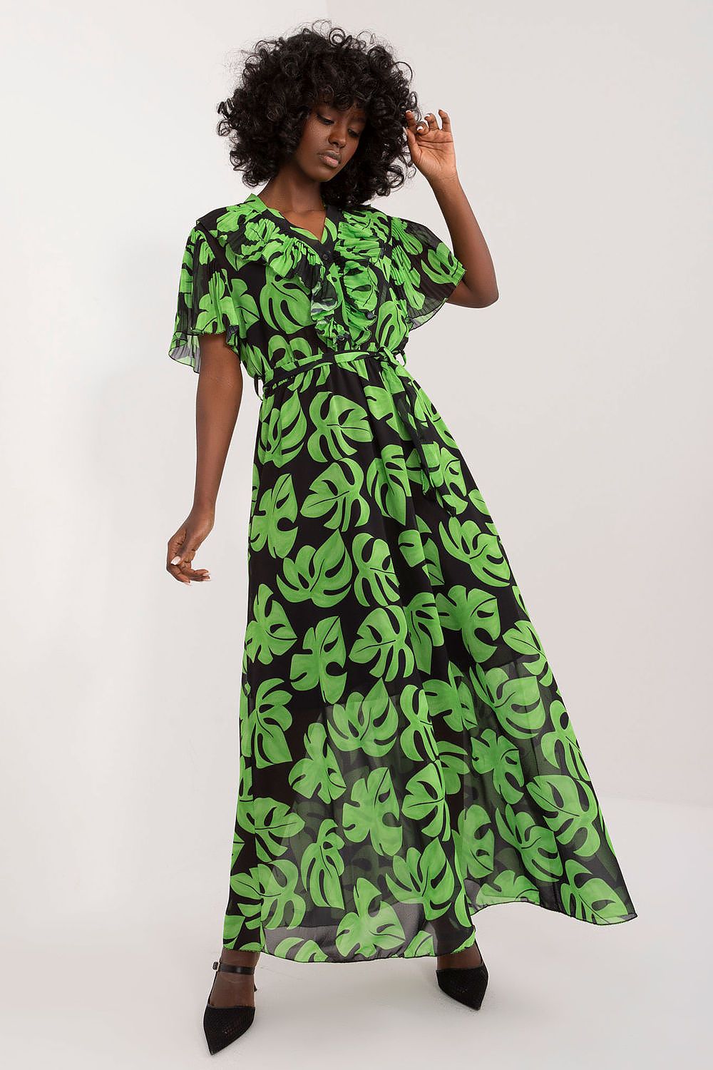 Summer floral dress with green leaf print, ruffled short sleeves, and heart neckline.