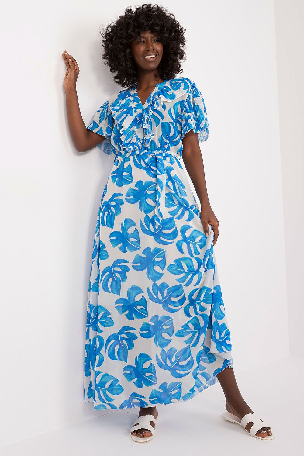Summer Floral Dress with blue leaf print, maxi length, and ruffle sleeves.