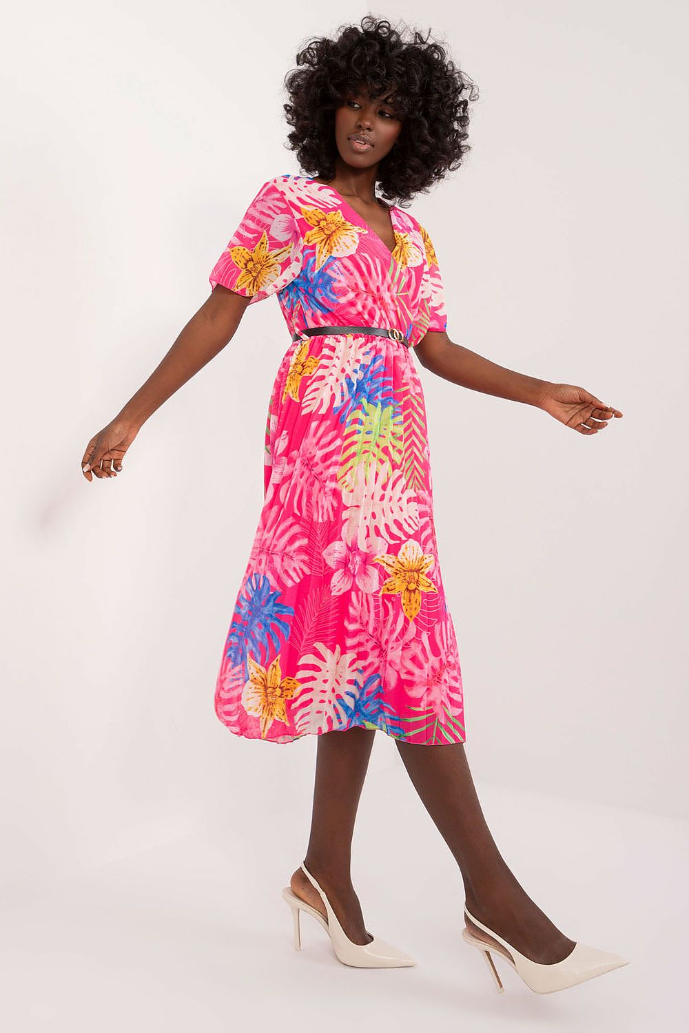 Summer floral dress with envelope neckline, short sleeves, and pleated hem.