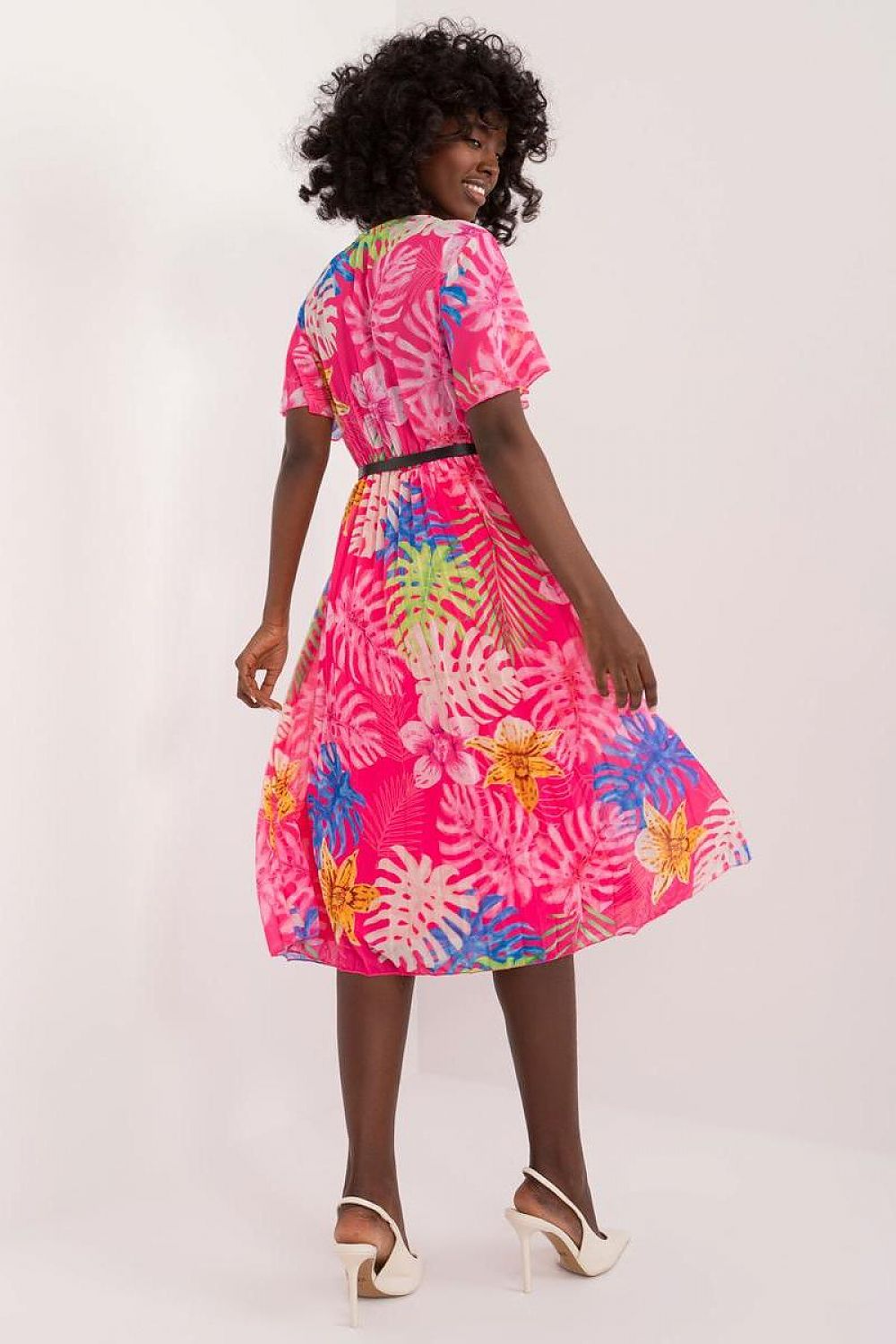 Summer floral dress with flared cut, envelope neckline, pleated hem, pink floral pattern, and short sleeves.