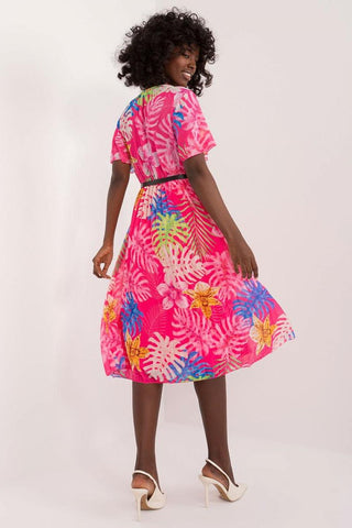 Summer floral dress with flared cut, envelope neckline, pleated hem, pink floral pattern, and short sleeves.