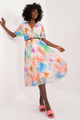 Summer floral dress with flared cut, short sleeves, envelope neckline, and pleated hem.