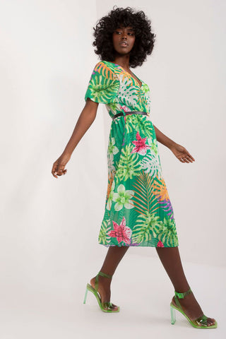 Summer floral dress with flared cut, short sleeves, envelope neckline, and pleated hem.
