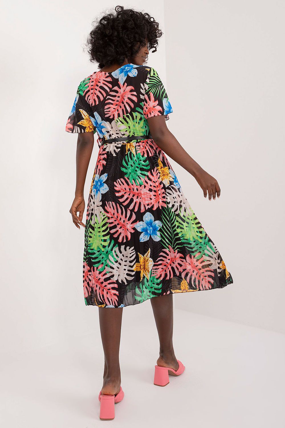 Summer floral dress with colorful print, flared cut, short sleeves, and pleated hem.