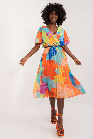 Summer floral dress with envelope neckline, flared cut, and pleated hem, perfect for warm occasions.