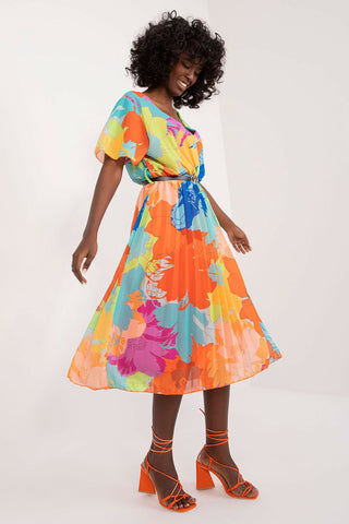 Summer floral dress with a flared cut, short sleeves, envelope neckline, and pleated hem, perfect for summer occasions.
