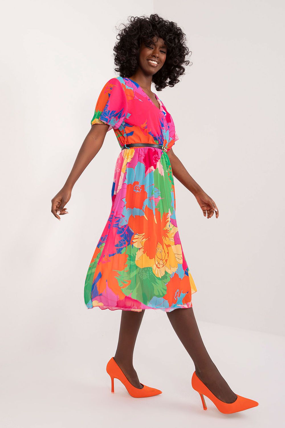 Summer floral dress with flared cut, short sleeves, envelope neckline, and pleated hem.