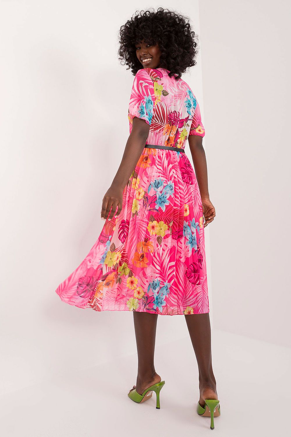 Summer floral dress with short sleeves, envelope neckline, and pleated hem.