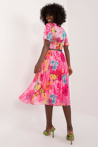 Summer floral dress with short sleeves, envelope neckline, and pleated hem.