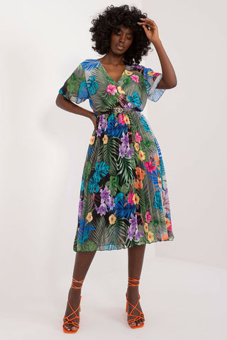 Summer floral dress with flared cut, short sleeves, envelope neckline, and pleated hem.