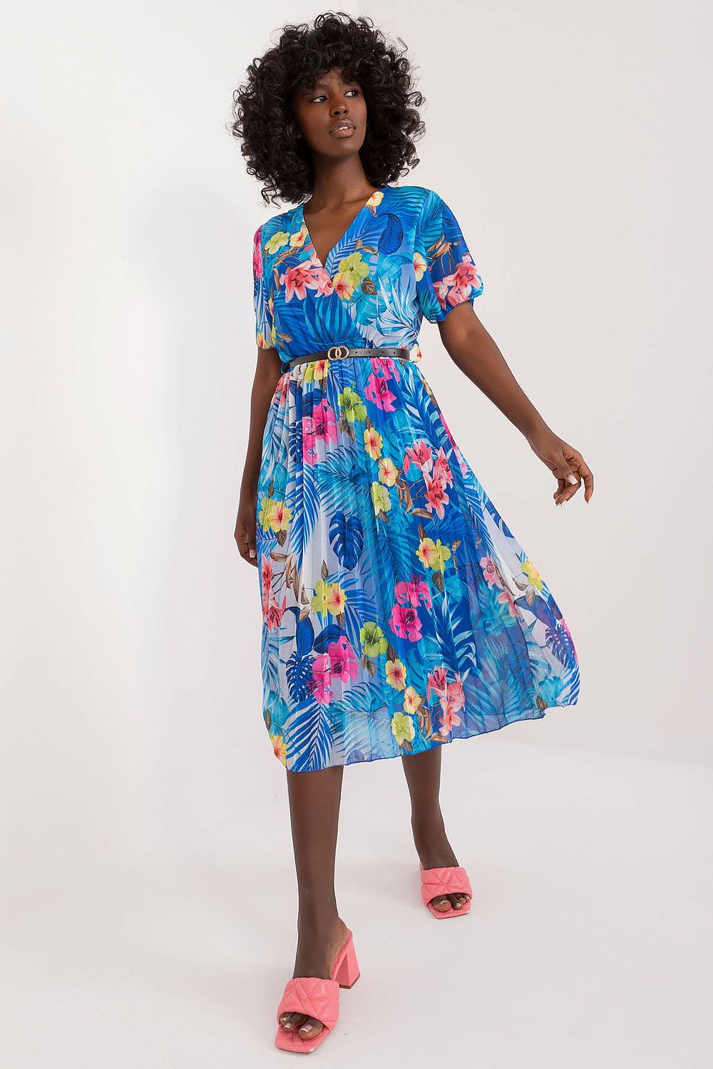 Summer floral dress with a flared cut, short sleeves, envelope neckline, and pleated bottom hem.