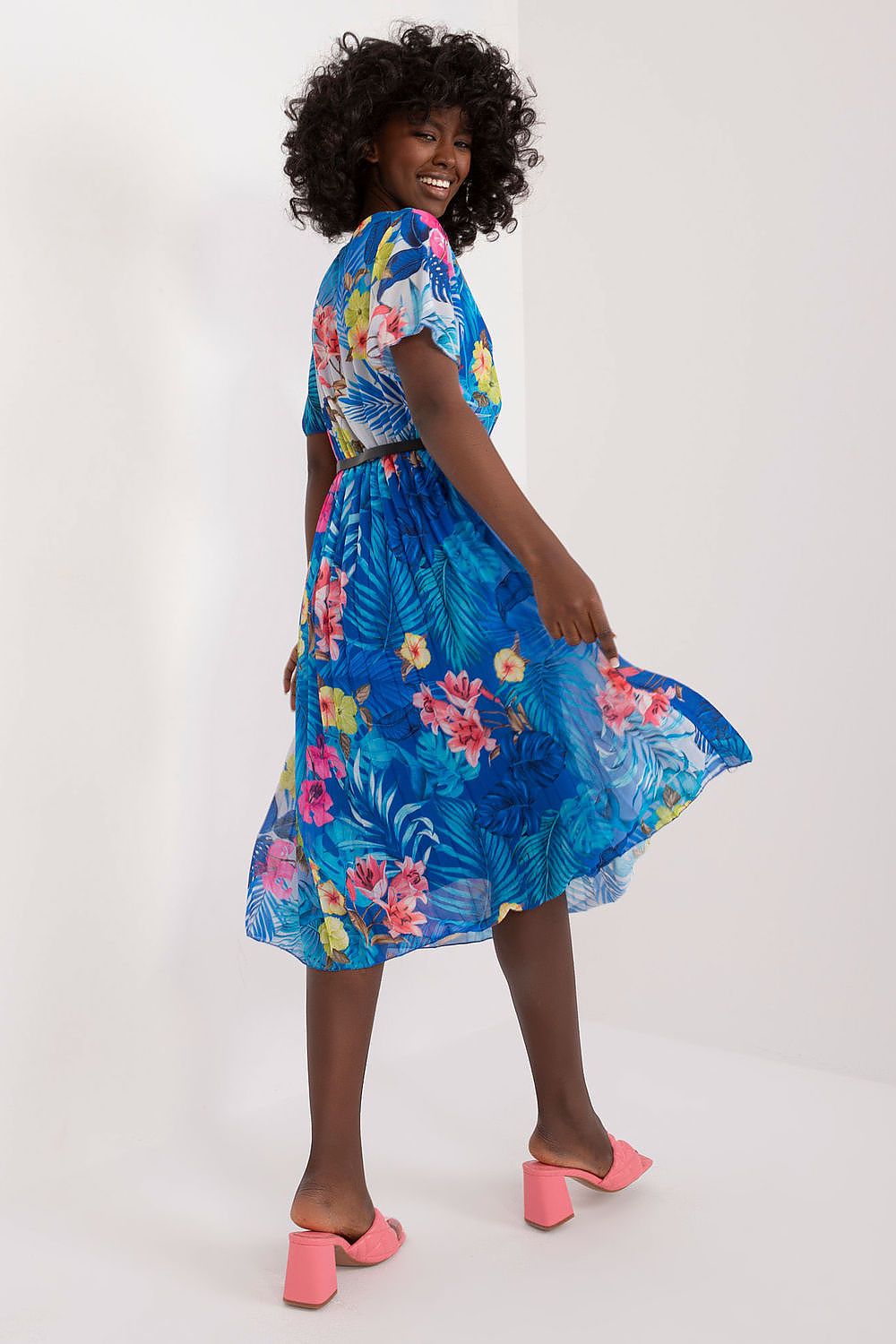 Summer Floral Dress with short sleeves, envelope neckline, and pleated hem.