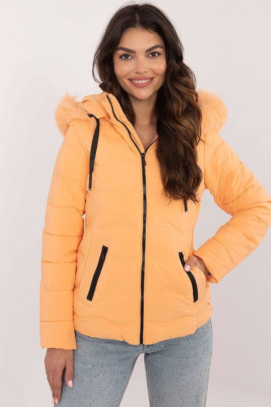 Women’s Winter Jacket in orange with detachable hood and zippered pockets.