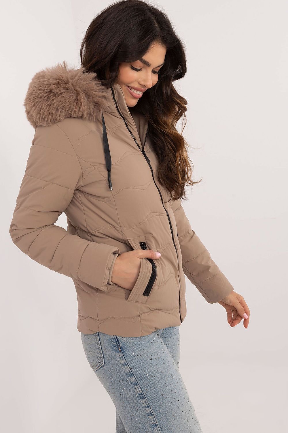 Women’s winter jacket in beige with quilted design and faux fur hood.