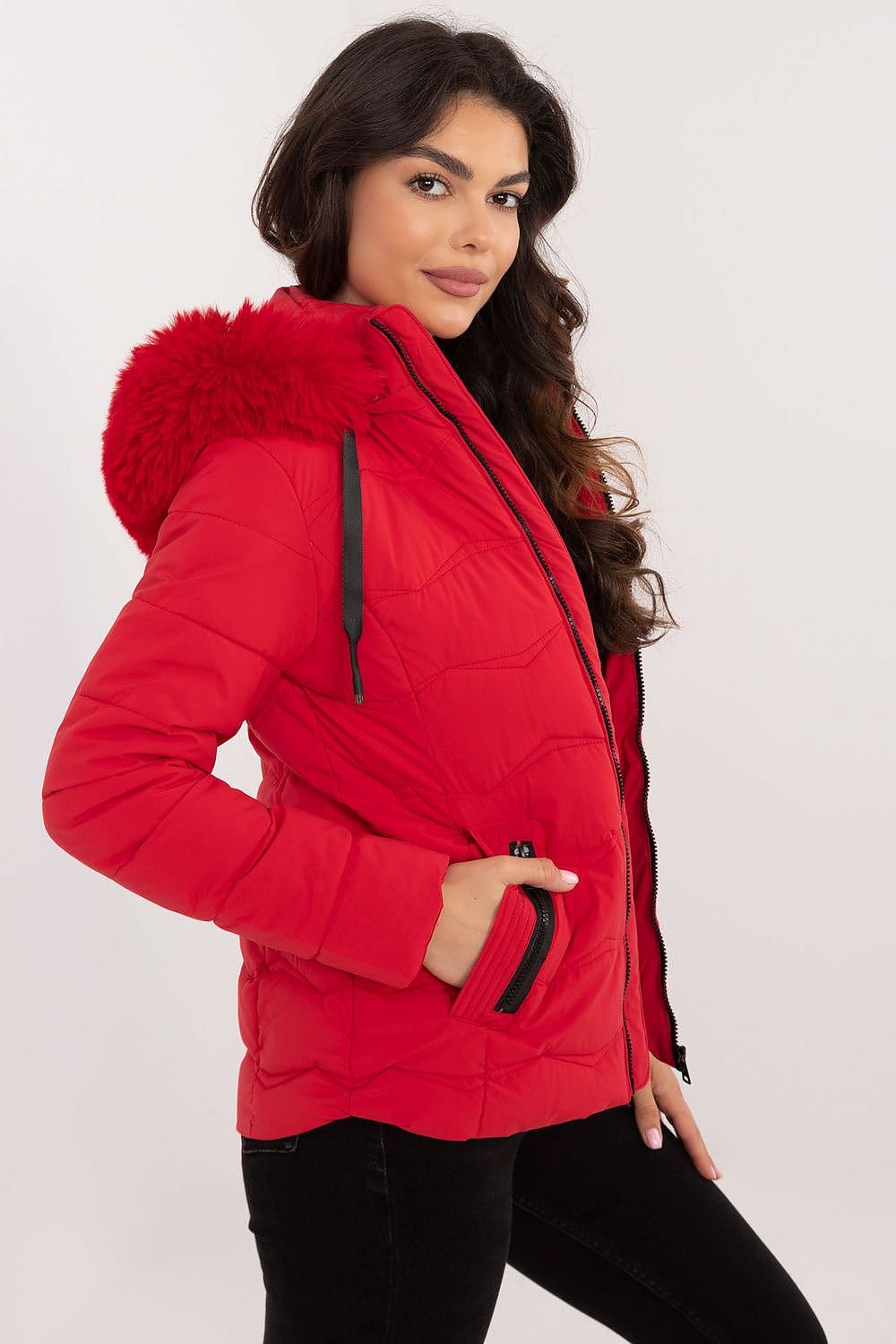 Women's red winter jacket with hood and zippered pockets.