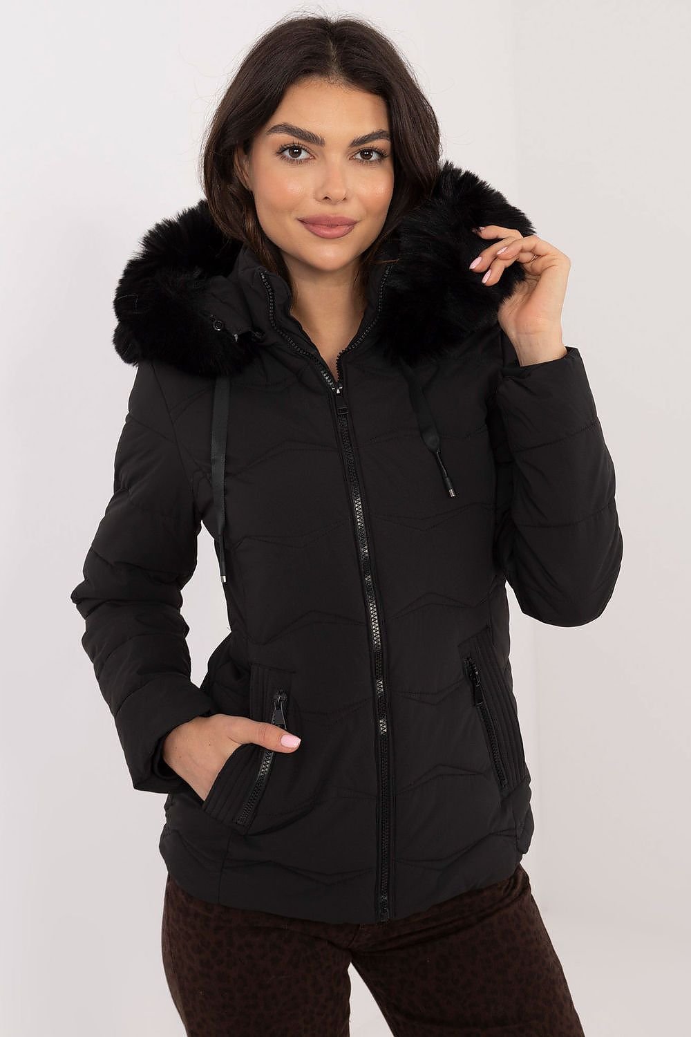 Women’s winter jacket with synthetic down, quilted style, integrated hood, zipper closure, and zippered pockets.
