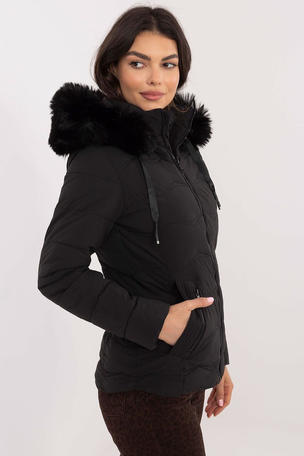 Women's winter jacket with faux fur hood, quilted design, side zippered pockets, and zipper closure.