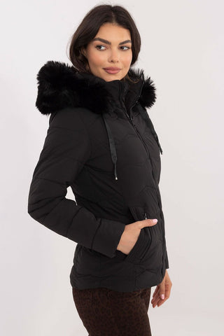 Women's winter jacket with faux fur hood, quilted design, side zippered pockets, and zipper closure.