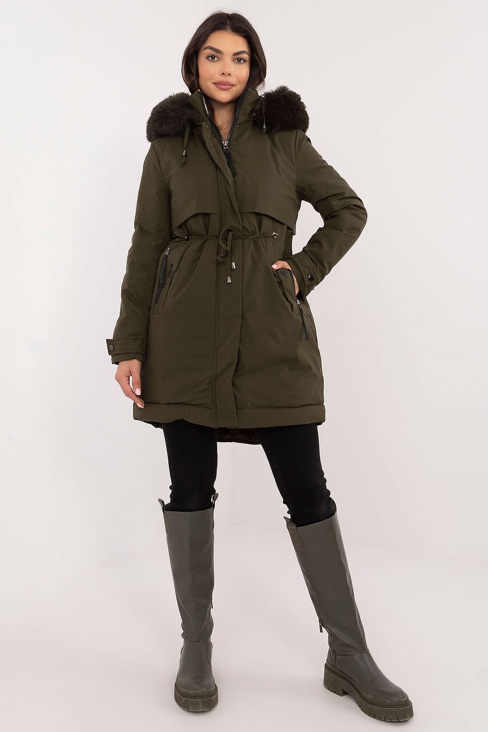 Transitional jacket with detachable fur and hood, featuring a waist belt, quilted design, and side zippered pockets.
