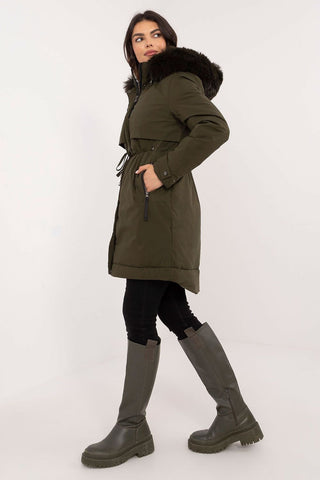 Transitional jacket with detachable fur hood and waist belt.