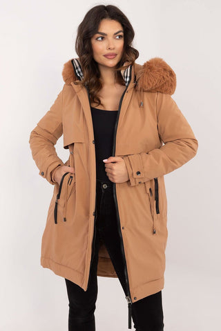 Transitional jacket with detachable fur hood and waist belt, worn by a model.