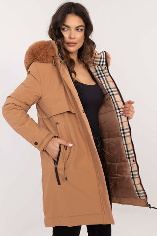 Transitional jacket with detachable fur hood, quilted design, waist belt, and zippered pockets.