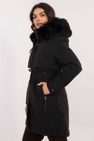 Transitional jacket with detachable fur hood and waist belt.