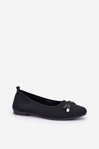 Women's black ballet flats with mesh material and bow detail.