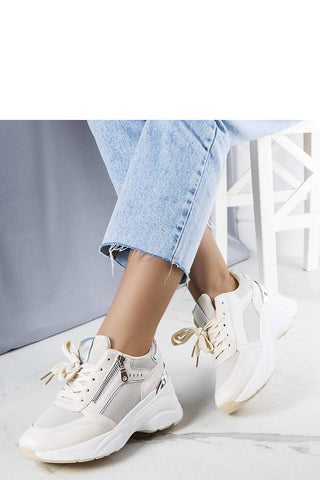 Limited edition beige wedge sneakers with white rubber sole and laced design.