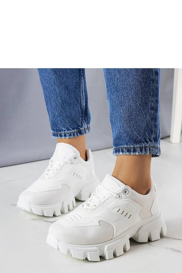 White chunky platform sole sneakers Inez styled with casual blue jeans for summer fashion
