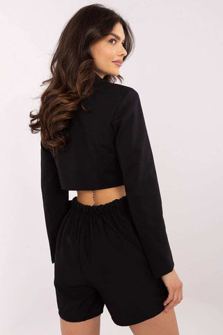 Elegant skirt pants with high waist and wide legs, featuring subtle pleats and a tie at the waist for a feminine charm.