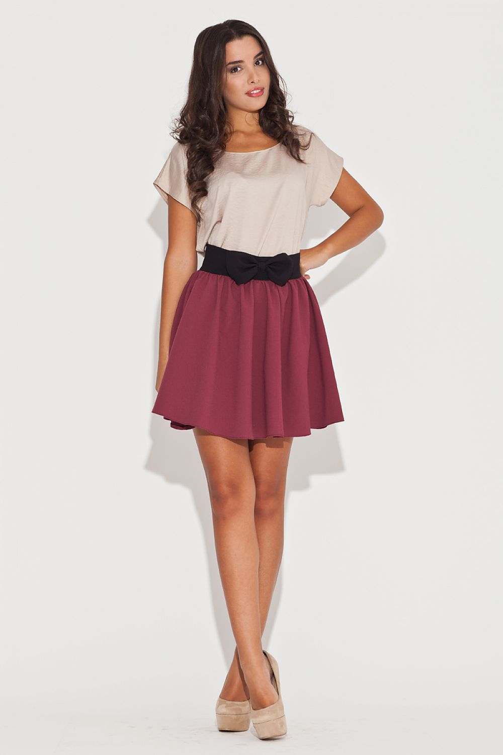 Flared skirt with contrasting belt and girlish bow, mini length.