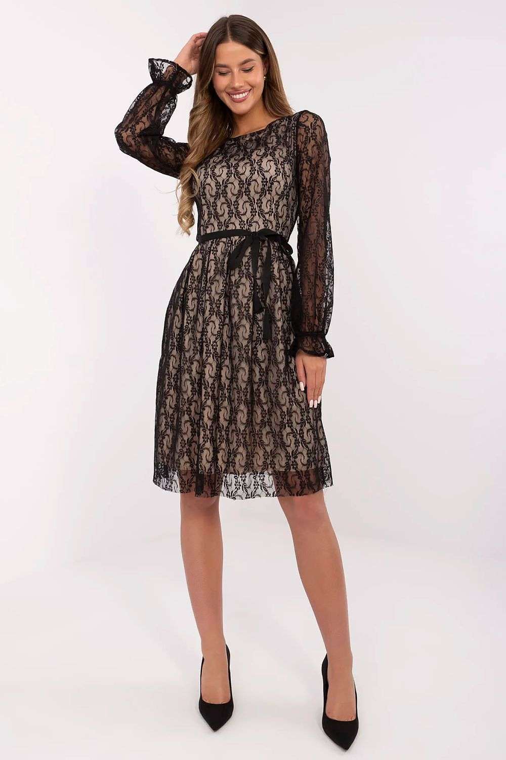 Knee-length black lace cocktail dress with long sleeves and tie belt.