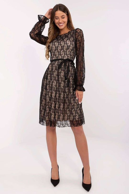 Knee-length black lace cocktail dress with long sleeves and tie belt.