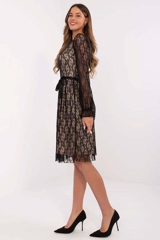 Classic cocktail dress with lace overlay and flared silhouette.