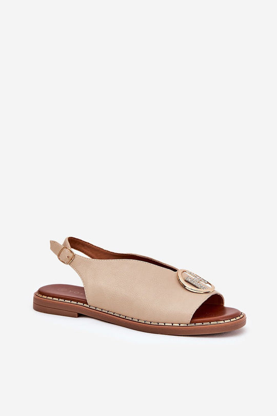 Elegant eco-leather sandals with embellishment and adjustable strap.