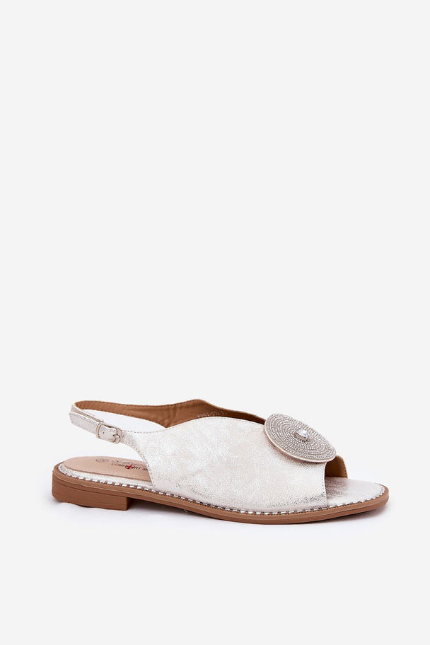 Women’s white sandals with flat heel, eco leather, and buckle strap.