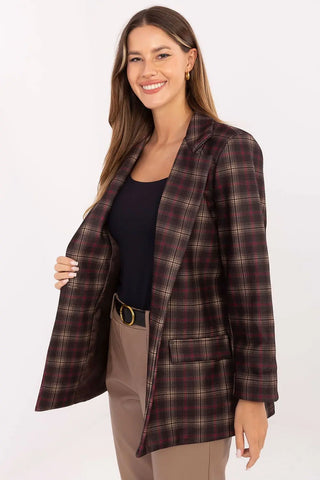 Woman wearing stylish brown and black checked blazer with shoulder pads and long sleeves