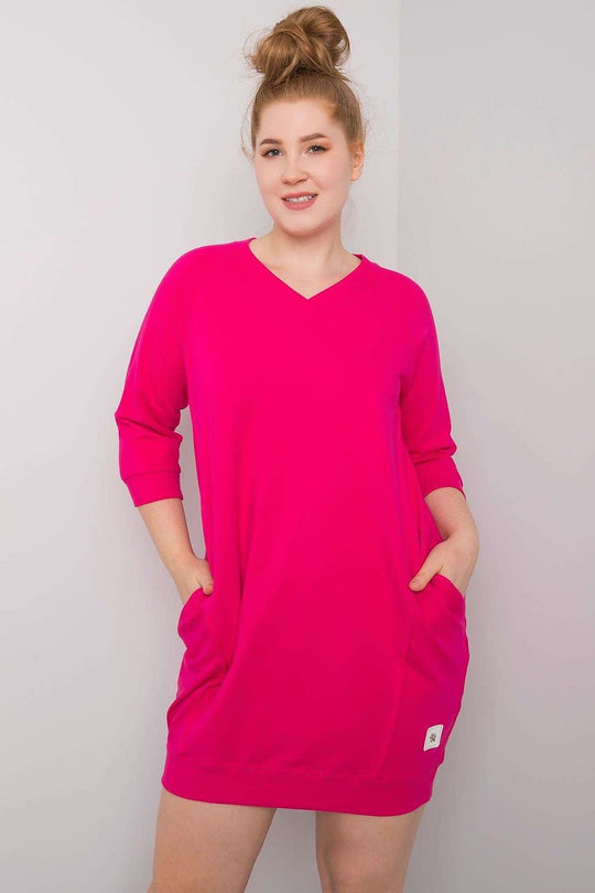 Fuchsia plus size dress with 3/4 sleeves and pockets.