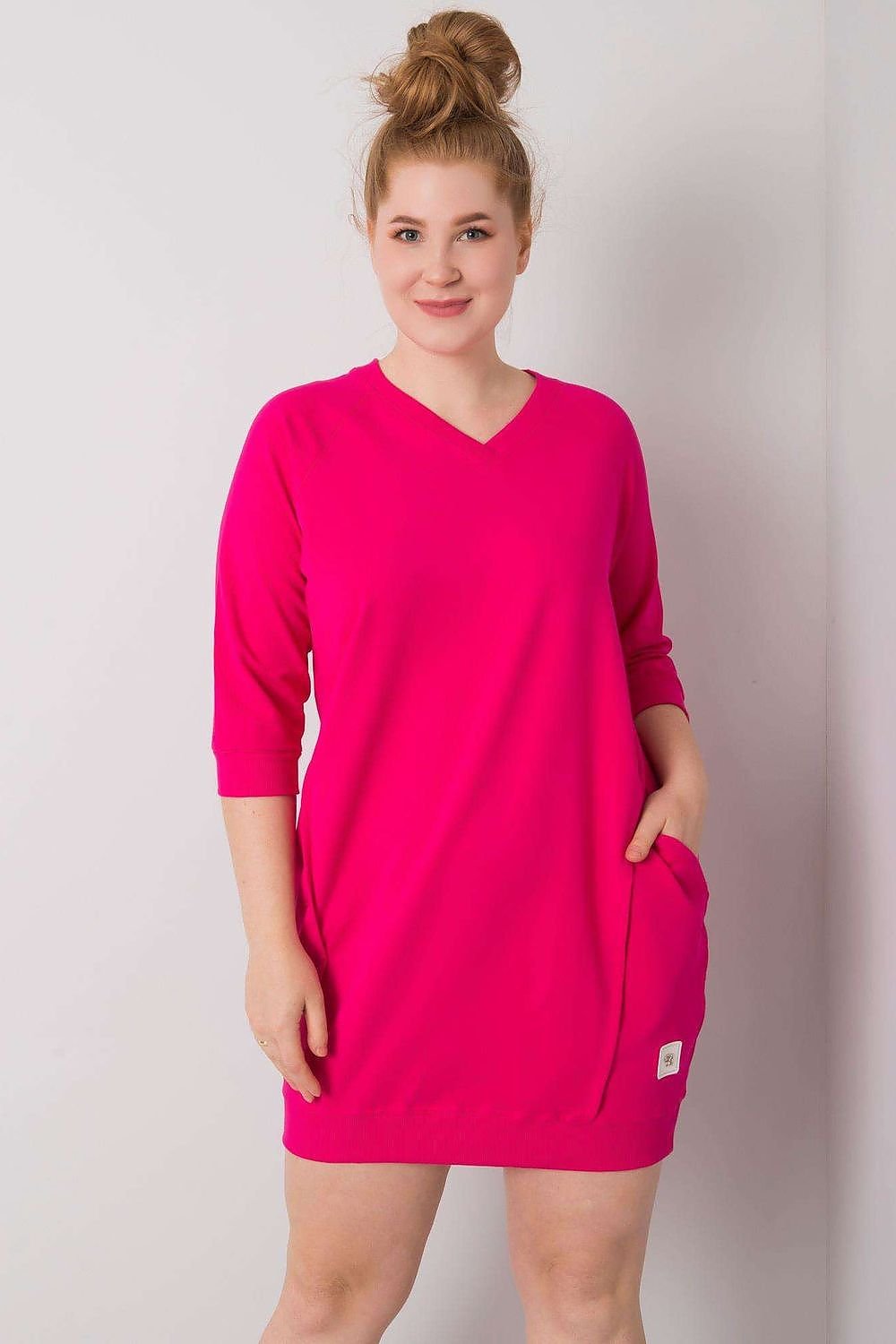 Fuchsia plus size dress with 3/4 sleeves and pockets.