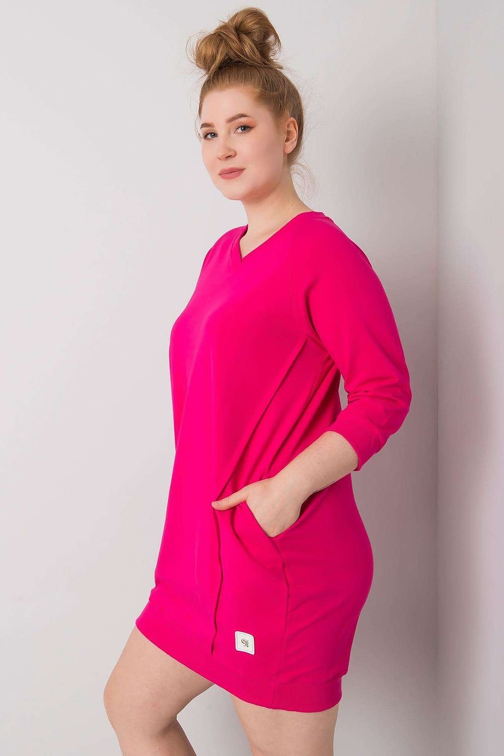 Stylish fuchsia plus size dress with 3/4 sleeves and pockets.