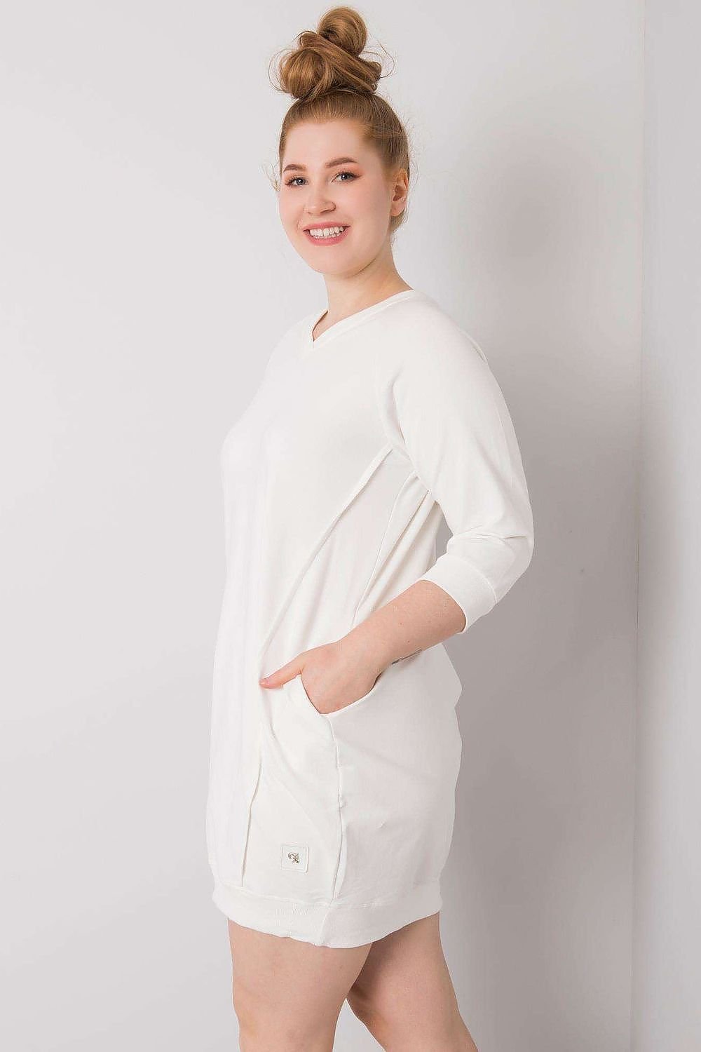 Plus size dress in soft cotton-spandex with 3/4 sleeves and pockets, perfect for versatile wear.