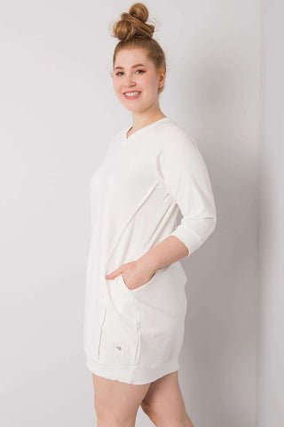 Plus size dress in soft cotton-spandex with 3/4 sleeves and pockets, perfect for versatile wear.