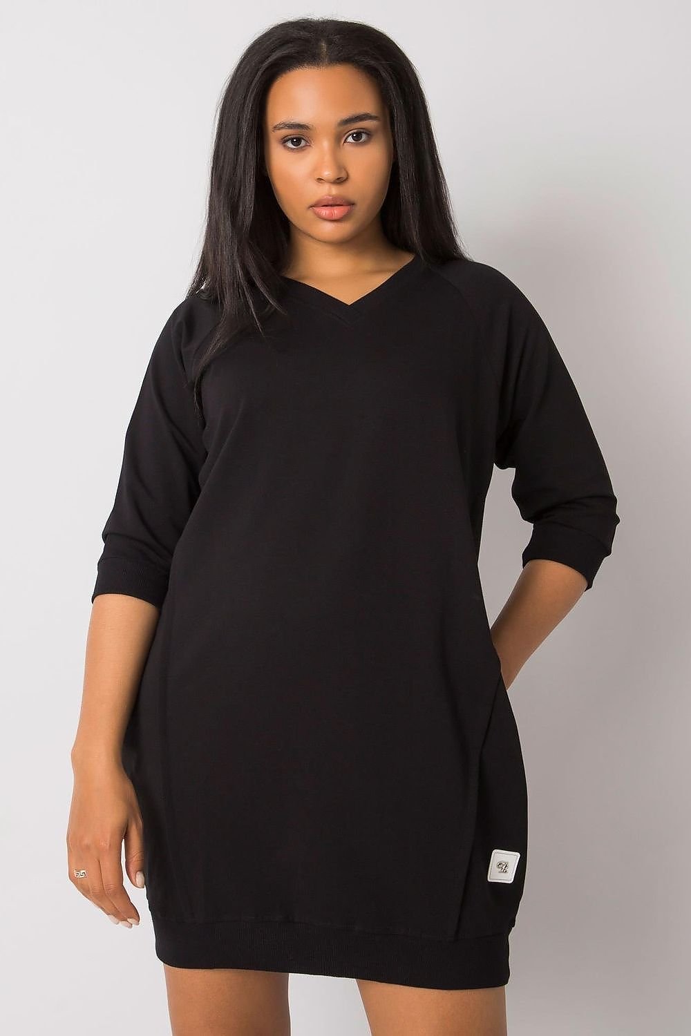 Stylish plus size dress with 3/4 sleeves in black fabric.
