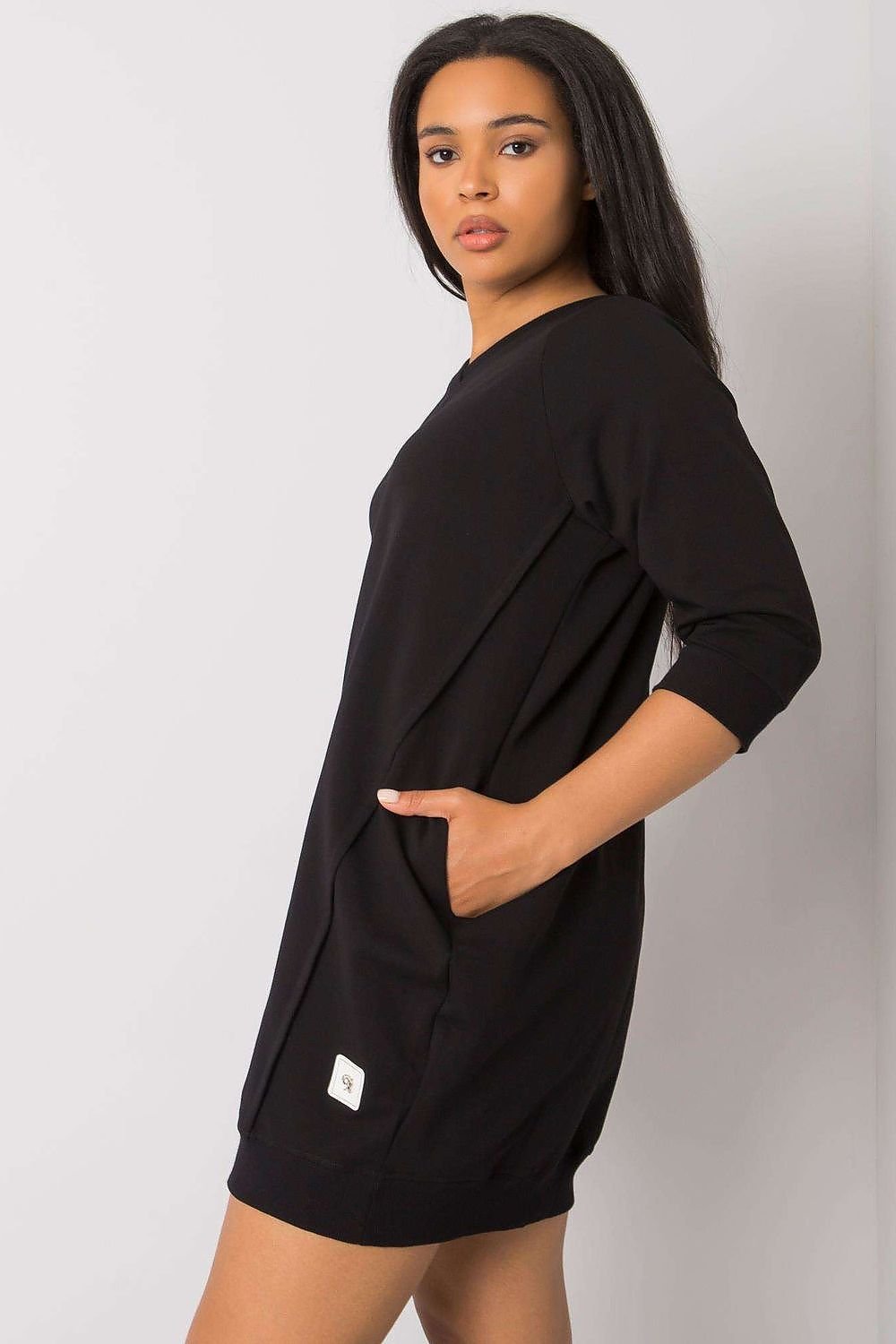 Stylish plus size dress with 3/4 sleeves and pockets in fuchsia color.