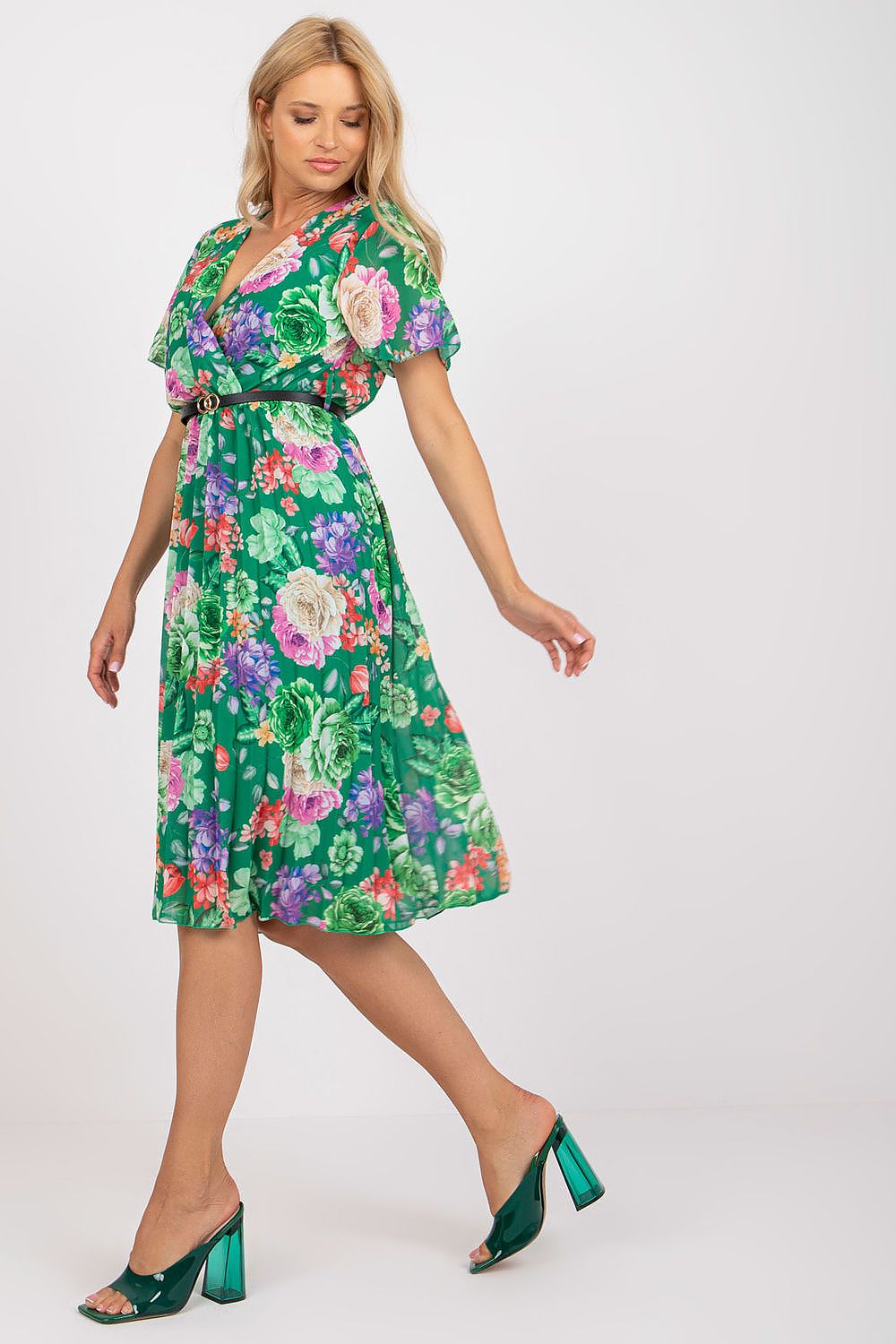 Summer floral dress with flared cut, short sleeves, and envelope neckline.