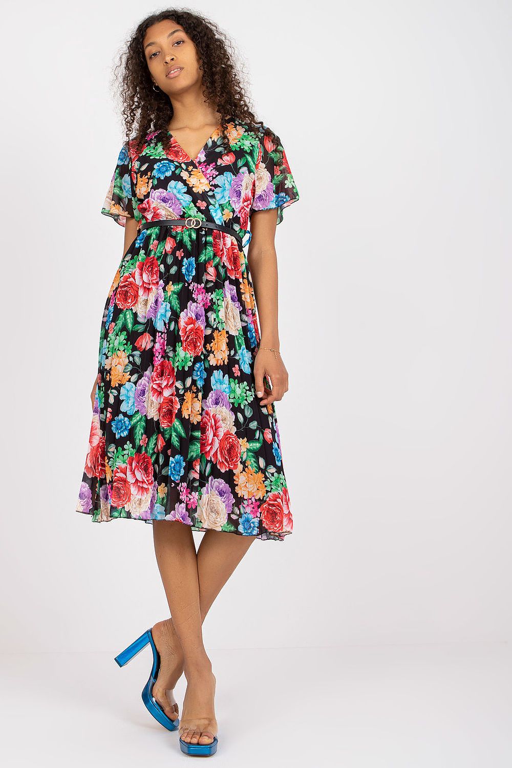 Summer floral dress with short sleeves, envelope neckline, and pleated hem.